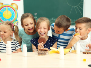 Cute children at lunch time in classroom Grande Prairie Foodbank Drive