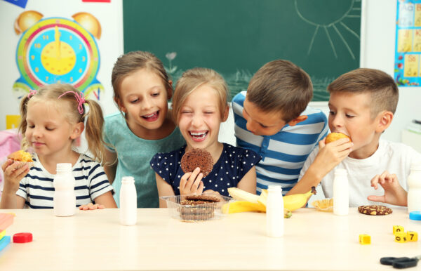 Cute children at lunch time in classroom Grande Prairie Foodbank Drive